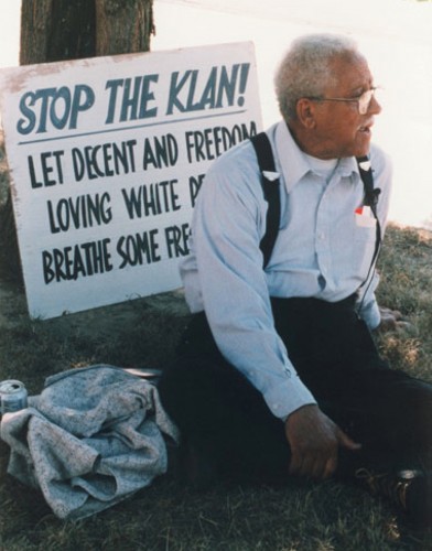 Protesting the KKK with the sign "Let Freedom Loving White People Breathe Some Fresh Air." Courtesy of Cynthia Carr.