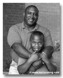 A black father with his son