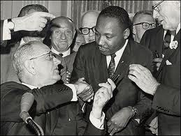 President Lyndon Baines Johnson gives the Rev. Martin Luther King, Jr., the pen he used to sign the 1964 Civil Rights Act