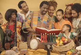 A family celebrates Kwanza by lighting the seven candles of the kinara and talking about the seven principles.