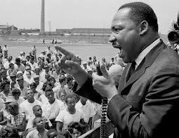 The Rev. Dr. Martin Luther King Jr. speaks at a rally held at the Robert Taylor Homes, an infamously poor and overcrowded public housing project in Chicago, in the 1960s. (Robert Abbott Sengstacke/Getty Images)