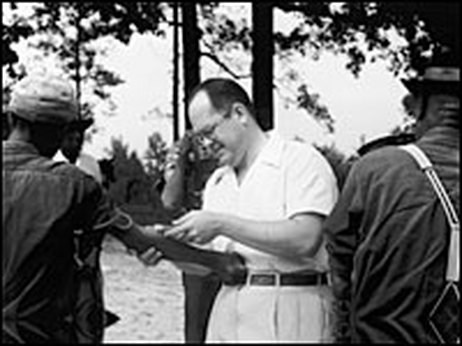 A scientist from the Tuskeegee Experiment with an object of study.
