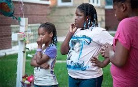 Friends of Heaven Sutton, one of 2012's youngest victim to Chicago's gun violence, at a celebration for what would've been her eighth birthday on Sept. 26, 2012. Photo by Ashlee Rezin.
