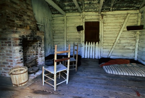 Replica of Slave Quarters: This replica of the interior of a slave cabin displays the squalid living conditions of these forced laborers (Baton Rouge, c. 1999). (Photo Credit: Richard Cummins/CORBIS)