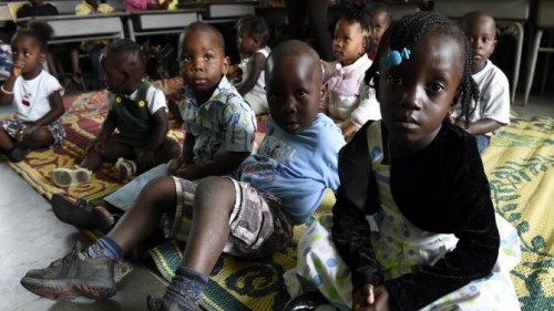 Children stand in a nursery while their parents are away at church on Sept. 28, 2014, in Monrovia, Liberia.