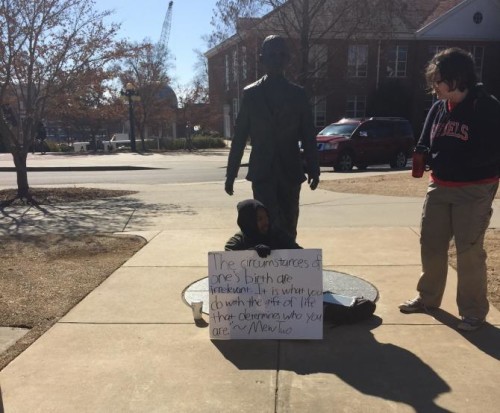 Correl Hoyle holds his vigil before the James Meredith statue at the University of Mississippi.