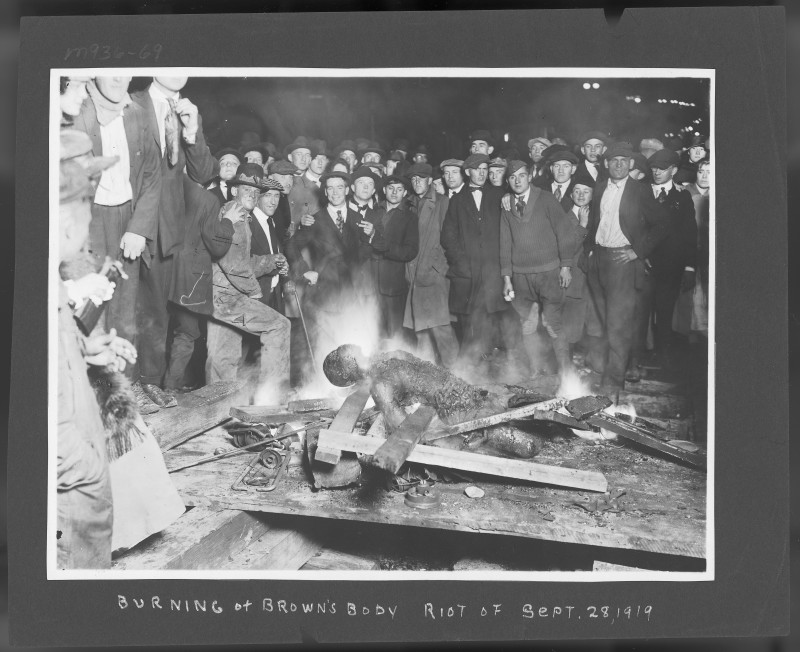 WillBrownlynchingOmaha The lynching crowd poses as Brown's body burns. No one served time for their participation in the riot or lynching. Brown was buried in a pauper's grave. His death was recorded in a log with just his name and the word "Lynched."