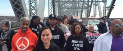 Justice League marchers cross a bridge from Staten Island into New Jersey.