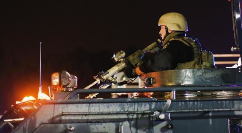 Police confront demonstrators in Ferguson, MO on August 15, 2014.