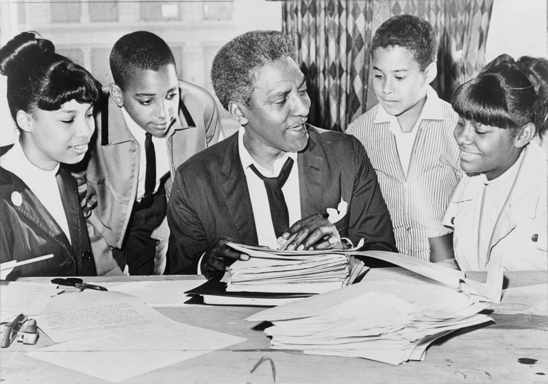 Working with young civil rights activists before a demonstration, 1964. New York World-Telegram & Sun photo by Ed Ford. Library of Congress.
