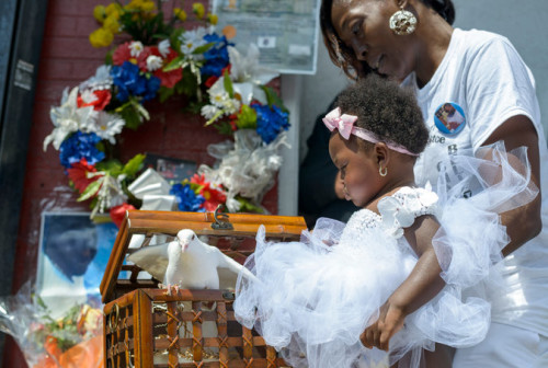 Legacy Garner and her mother, Jewel Miller, release a dove to mark the anniversary of Eric Garner's death.