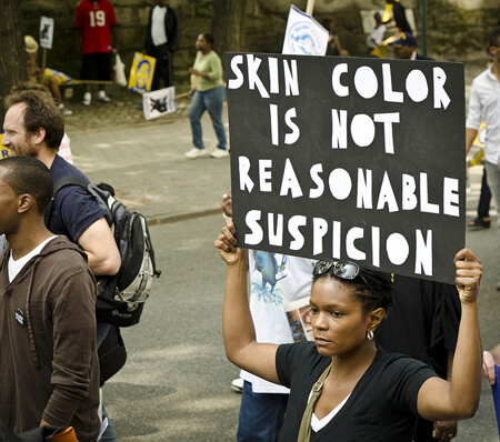 Activists protest silently to protest racial profiling.  (Photo by Annette Bernhardt)