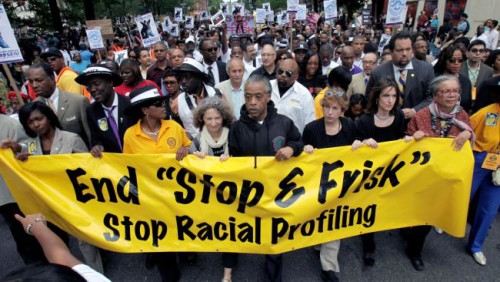 Protestors march to send the 'stop and frisk' procedure in New York City. (Photo by Seth Wenig)