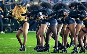 Beyonce with backup dancers dressed as Black Panthers during the Super Bowl halftime show.