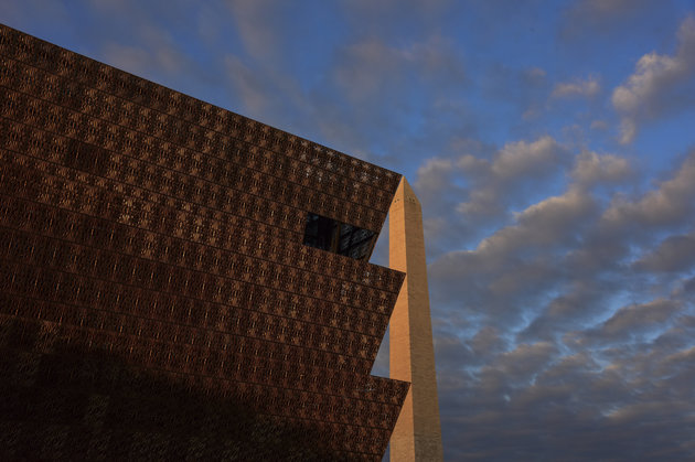 nmaahc-wash-monumt The morning sun paints the Washington Monument red as it skims the top of the National Museum of African American History and Culture - NMAAHC in Washington, DC. The new museum opened to the public September 24, 2016. When viewed from particular angles, the two structures fit together like puzzle pieces.
(Photo by Jahi Chikwendiu/The Washington Post via Getty Images)