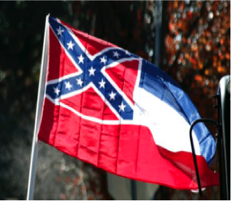 A Mississippi state flag is unfurled by Sons of Confederate Veterans and other groups on the grounds  of the state  Capitol in Jackson , Mississippi. (AP Photo/Rogelio V. Solis, File)