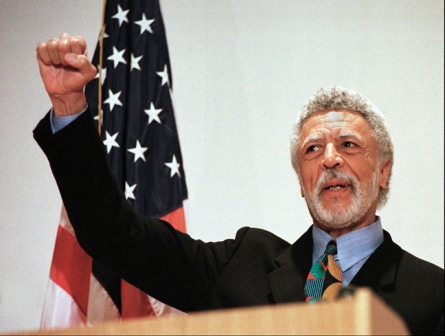 In this Nov. 17, 1997 file photo Democratic Rep. Ron Dellums raises his fist while announcing his retirement from Congress at a news conference in Oakland, Calif. Dellums, a fiery anti-war activist who championed social justice as Northern California’s first black congressman, has died at age 82. Longtime adviser Dan Lindheim says Dellums died early Monday, July 30, 2018, at his home in Washington, D.C., of cancer. (AP Photo/Ben Margot, File)