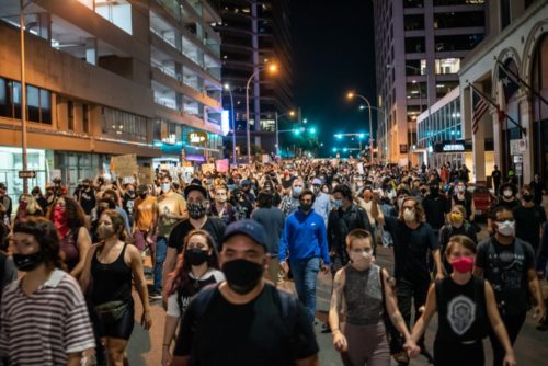 rmuivego0vylmgtk0cfs People walk down street in Austin after vigil