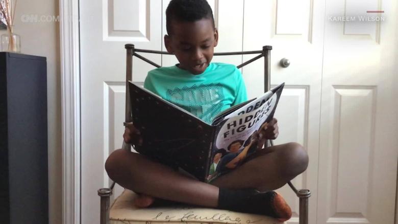 8 year old boy reading Hidden Figures