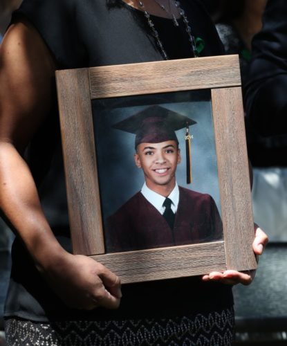 EBT-L-WCOISSUE-0615-4 Photo of Miles Hall in his mother's (Taun Hall) hands.