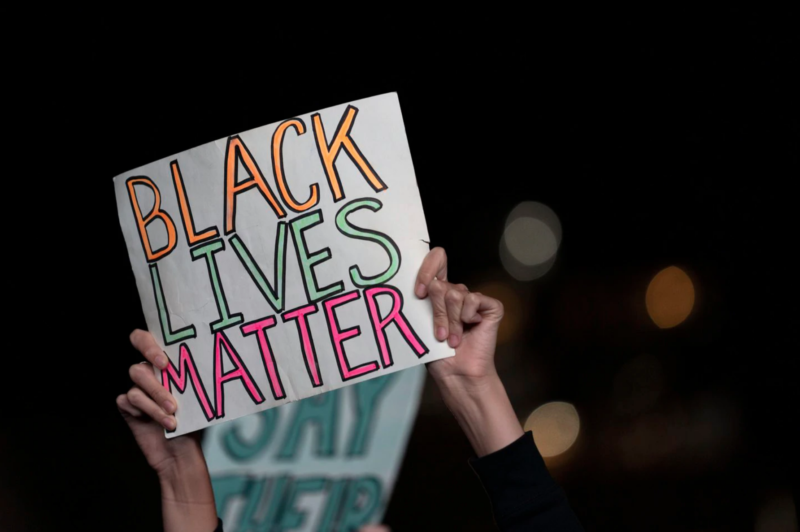 A protester holds up a Black Lives Matter sign