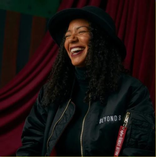 Picture of Black Beauty Artist Picture of Brittney Escovedo, a black beauty artist, laughing.
