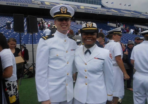 Currently chief strategy officer at the Black Veterans Project, Daniele Anderson served aboard Navy ships for five and a half years. Anderson says removing Confederate names and symbols from military bases and installations would be a step toward racial reconciliation with Black people who served their country. Here, she is photographed with classmate Alex Kane following their graduation and commissioning ceremony at the U.S. Naval Academy in May 2013. 