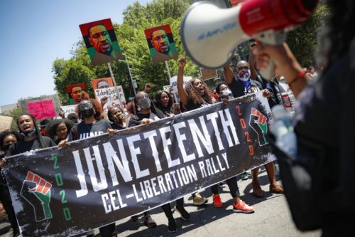800 June 19, 2020. Protesters chant as they march after a Juneteenth rally at the Brooklyn Museum, in the Brooklyn borough of New York. (AP Photo/John Minchillo, File)