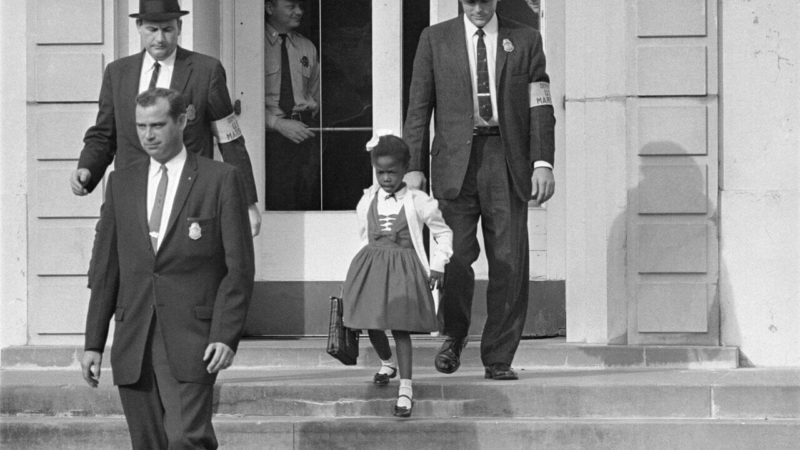 U.S. Deputy Marshals escort 6-year-old Ruby Bridges from William Frantz Elementary School on November 14, 1960.