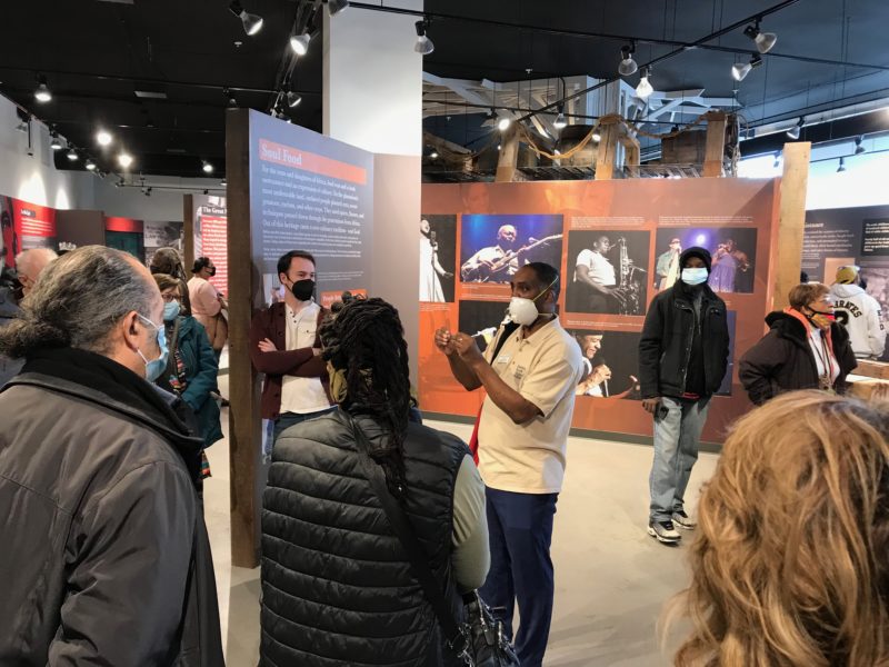 IMG_7409 Head Griot (docent) Reggie Jackson helps visitors expand their knowledge and understanding of the long history of Black American achievement. (Dr. Fran Kaplan, ABHM)