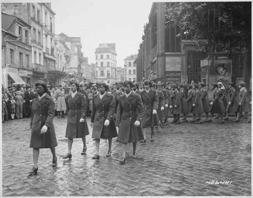 Members of the 6888th Central Postal Directory Battalion participate in a parade ceremony in honor of Joan d’Arc at the marketplace where she was burned at stake in 1945. (Smith Collection/Gado via Getty Images)