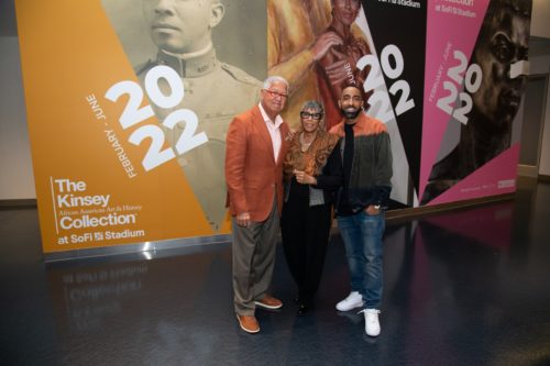 (Left to right) Bernard, Shirley, and Khalil Kinsey pose at the Kinsey Collection on display at SoFi Stadium. (Adam Pantozzi/SoFi Stadium)
