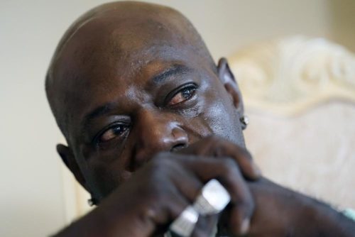 Aaron Larry Bowman cries during an interview at his attorney's office, Thursday, Aug. 5, 2021, as he discusses his injuries resulting from a traffic stop in 2019. (AP Photo/Rogelio V. Solis)