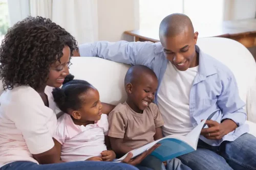 Black families can teach about history by reading together at home (wavebreakmedia/Shutterstock)
