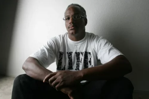 Herman Atkins, at his  Fresno home in 2008 after spending more than eight years in jail until DNA evidence proved his innocence. (Gary Kazanjian / AP file)