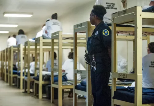 A guard watches over inmates at Julia Tutwiler Prison for Women, one of Alabama's overcrowded correctional facilities (Montgomery Advertiser)