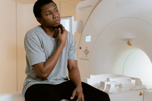 A Black patient sits on an MRI (Mart Production/Pexels)
