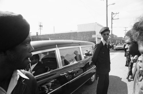 Black Panthers stand as the funeral procession for George Jackson in 1971. (AP Photo/Robert Klein, File)