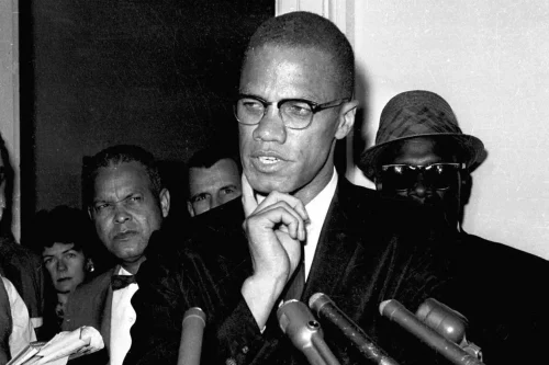 211118-malcolm-x-ew-142p-bb8485 Malcolm X speaks to reporters in Washington, D.C., on May 16, 1963. (AP file)