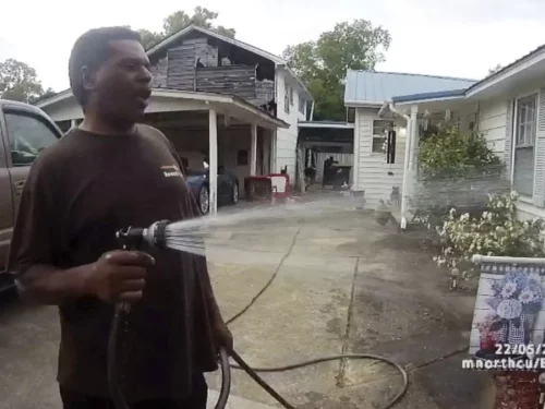 PastorJennings-e381e464a9e707c442934dcfcf4c6377158b3c0b-s900-c85 Michael Jennings was watering a neighbor's flowers when the cops showed up and placed him under arrest. (Childersburg Police Department via AP)