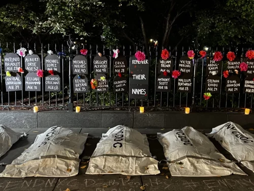 Body bags and names of those who died in DOC custody this year (Tandy Lau)