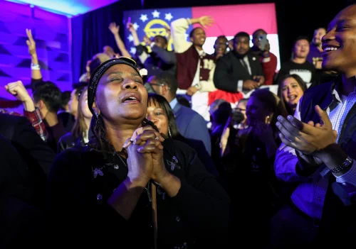 221208-raphael-warnock-victory-celebration-se-1124a-df6b00 Supporters cheer Tuesday as the Georgia Senate runoff is called for Sen. Raphael Warnock at an election-night watch party in Atlanta. (Win McNamee / Getty Images)