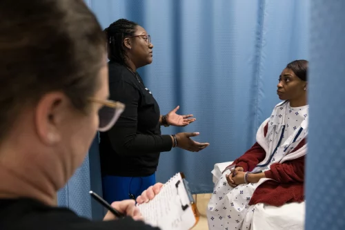 221209-sexual-assault-nurse-traiing-mjf-1310-6285a0 Beth Andrews-Arce, left, and Sharita Godwin, center, role play through an examination during sexual assault nurse examiner training at Fayetteville State University. (Cornell Watson for NBC News)