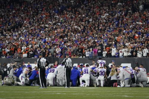 1000-1 The Buffalo Bills players pray for teammate Damar Hamlin during the first half of an NFL football game against the Cincinnati Bengals, Monday, Jan. 2, 2023, in Cincinnati. (AP Photo/Jeff Dean)