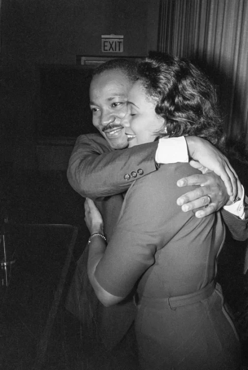 Dr. Martin Luther King, Jr. hugs his wife Coretta