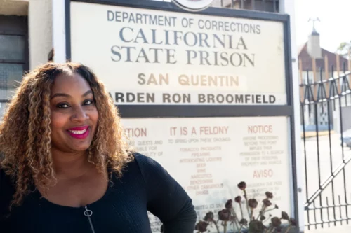 Portrait of Naimah McDaniel in front of San Quentin State Prison. (The Observer)