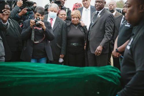 Dexter Wade's mother, Bettersten Wade, watches as his body is carried after being exhumed from a pauper's grave at the Hinds County jail's penal farm. (Ashleigh Coleman for NBC News)