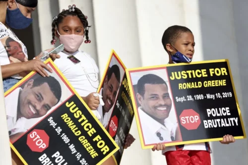 In this Aug. 28, 2020, file photo from Washington, D.C., family members of Ronald Greene, who died at the hands of police, listen to speakers as demonstrators gather for that year’s March on Washington on the 57th anniversary of the Rev. Martin Luther King Jr.’s “I Have A Dream” speech. (Michael M. Santiago/Pool via AP)
