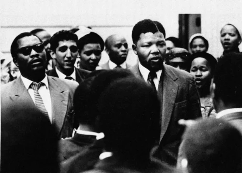 Magubane photographed Nelson Mandela outside the Drill Hall in Johannesburg during his first treason trial in 1958. (Peter Magubane/Drum/African Pictures)