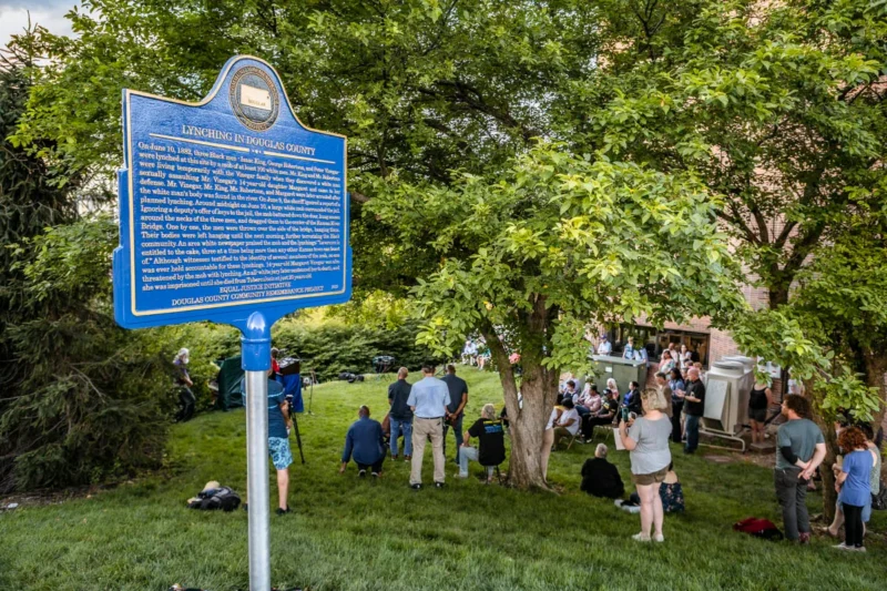 A crowd listens to a speech during the dedication of a historical marker remembering three Black men who were lynched in 1882.